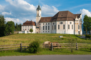 Fototapeta na wymiar Wies, Germany - July 19, 2019; Pilgrimage church Wieskirche a Unesco building and a popular tourist atraction on the romantic road in Bavaria