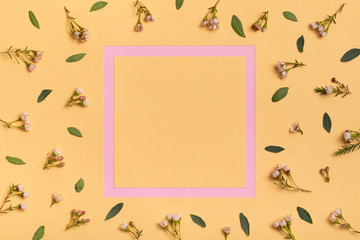 Beauty fashion pink and yellow summer flat lay. Minimal flower background.