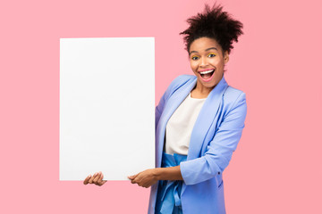 Smiling black woman holding white paper for promo