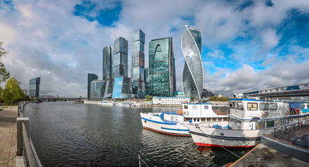 Fototapeta na wymiar Panorama of river ships and Moscow City - International Business Center, view from the embankment of the Moskva-river