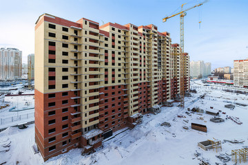 House construction and crane Proletarskay street in Zheleznodorozhny town in Moscow Oblast, Russia....