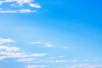 Blue sky background and white clouds soft focus, and copy space