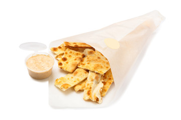 Salted crackers in a paper bag isolated on white background.
