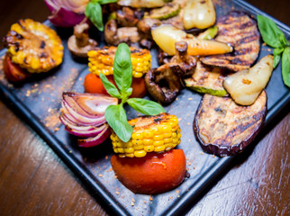 Tasty grilled vegetables on big plate. Healthy food. Restaurant.