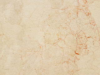 The plate is made of yellow marble with a red streaks. brownish-white shades. Smooth texture for design and decoration. Natural building material. Natural patterns on the stone. Plates for floor
