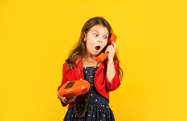 Little talker. Retro style. Communication concept. Shopping online. Retro girl speak phone. Kid talking vintage phone. Pinup girl conversation. Discuss gossip. Retro communications. Surprising news