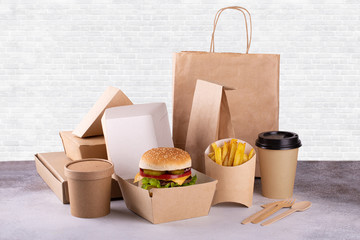 Recycling concept. Delivery food background. Fast food eco packaging with tasty hamburger, french...
