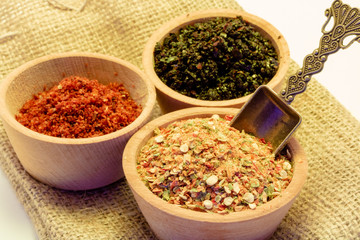 spices in bowls on the wicker
