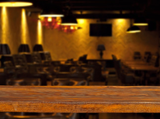 Old bar counter as layout for design. Workpiece for design. Empty place to advertise products. Blurred interior of the bar in the background.