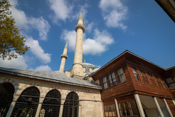 Fototapeta premium Valide Atik Mosque and a wooden house, which is built by Mimar Sinan, in Istanbul