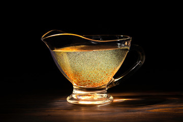 Natural organic sea-buckthorn  oil in glass vintage bottle on wooden background.