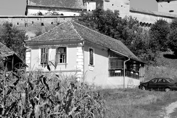 Typical rural landscape and peasant houses in  the village Alma Vii (Almen) Transylvania, Romania....