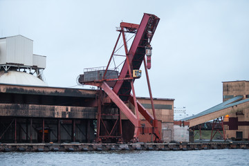Fototapeta na wymiar Port scene with large cranes in baltic sea port.
