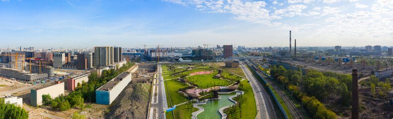 Scenic panoramic aerial view of the park and the construction of a new district in Moscow, Russia. ZILART in the south of Moscow. Landscape from a drone.