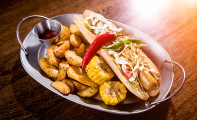 Hotdogs and French fries on a dishes. Fast food meal. Restaurant.