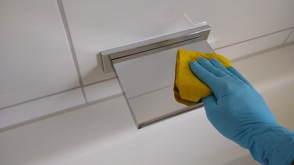 Fototapeta na wymiar Household - cleaning the bathroom - cleaning - home cleaning - hand with yellow rag