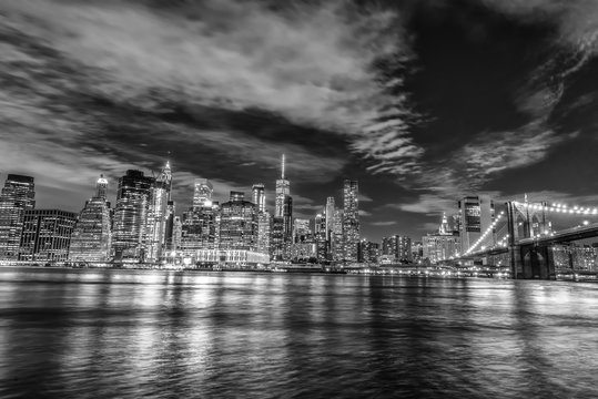 Skyline of Manhattan and Brooklyn bridge, night view © dade72