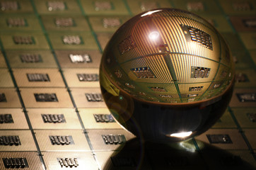 Detail of Computer CPU Chip reflected in to a crystal lensball. abstract background. tecnology background.