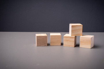 Wooden blocks arranged on a table with copy space