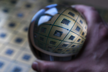 Detail of Computer CPU Chip reflected in to a crystal lensball. abstract background. tecnology background.