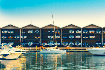 Multi-storey storage of boats and berths on its background