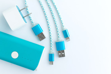 USB charging cables with smartphone and battery bank in top view