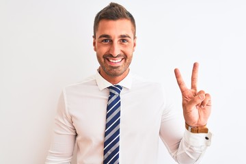 Young handsome elegant business man over isolated background showing and pointing up with fingers number two while smiling confident and happy.