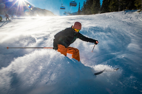 Snow cloud produced by aggressive braking from a young skier