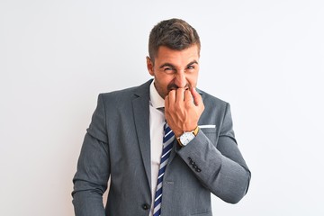 Young handsome business man wearing suit and tie over isolated background looking stressed and nervous with hands on mouth biting nails. Anxiety problem.