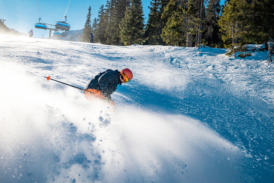 Snow cloud produced by aggressive braking from a young skier