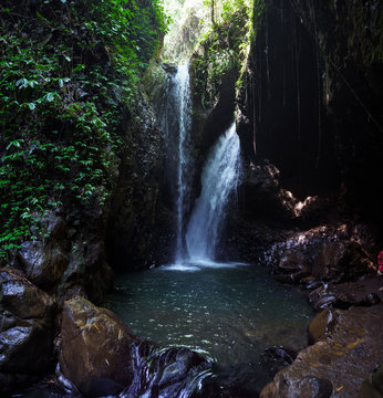 The Gitgit waterfall on the island of Bali. Waterfall in the tropical forest. Long exposure. Jungle river. Adventure in Asia, Indonesia