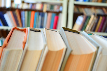 Bookshelf, interior blurred. Intentionally blurred to be used as background