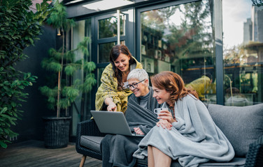 Image of a gorgeous family enjoy spending time together at home garden.