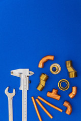 Set of tools for plumbing isolated on blue background with space for advertising