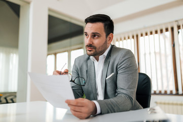 Fototapeta premium Portrait of a business executive talking to an employee about business report.