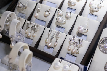 jewelry retail store showcase displaying  luxury pearls  sets