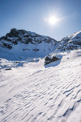 Beautiful alpine panoramic view snow capped mountains, European beautiful winter mountains.