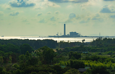 Fototapeta na wymiar Silhouette industrial factory on sea, Pollution environment background