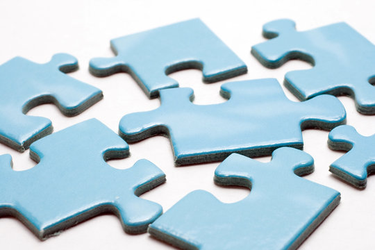 Blue puzzle pieces on white background