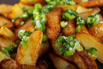 Baked potatoes with fresh green garlic sauce