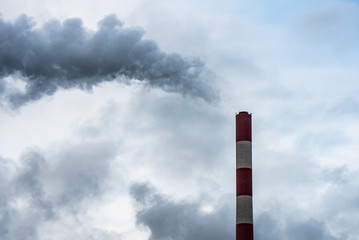Smoking factory chimney causing air pollution