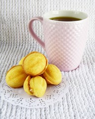 cup of tea and cookies on wooden table