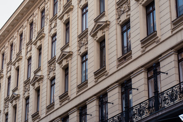 Fototapeta na wymiar Windows in old european buildings. Cityscape for tourism