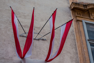 Red-white flags on a building. Flag of Vienna