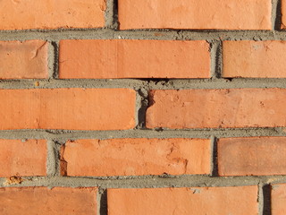 detailed fragment of a red brick wall