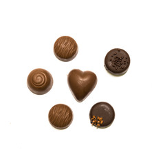 Studio shot wide selection of chocolate pralines isolated on white top view