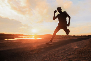 Fototapeta na wymiar Young fitness man runner athlete running at road for exercise.