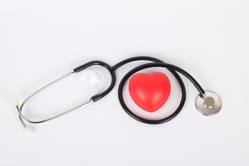 Stethoscope and heart isolated on white