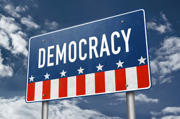 Democracy - rule by people road sign message