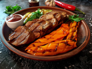 Grilled beef tongue with zucchini and pepper.